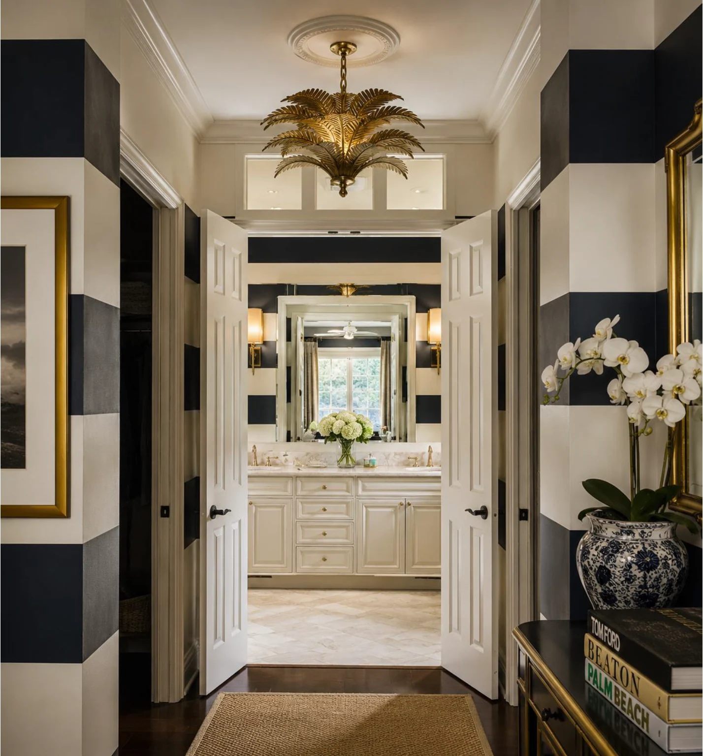 Sarasota residence dressing area and bath with black and ivory stripes and sculptural brass palm chandelier